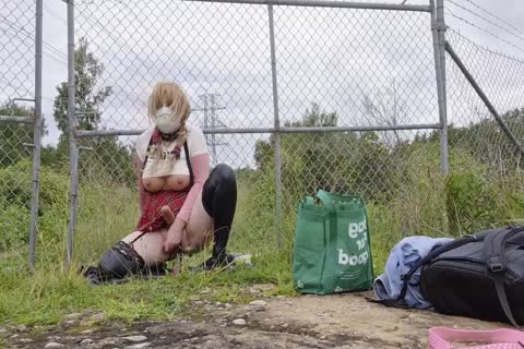 shemale Sissy Wearing A strapon And Riding Dildos In Public