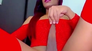 Purple-haired skinny latin chick tranny In Red stockings Strokes Her throbbing weenie On web camera