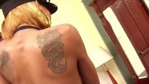 Tattooed Ladyboy In yummy Police Uniform Strokes Her Trimmed jock On The Table